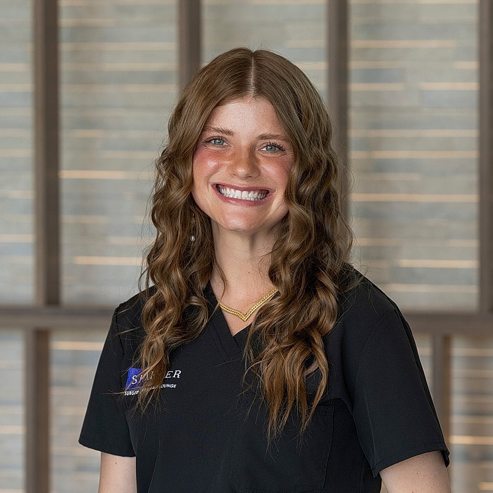 Smiling woman in a professional setting.