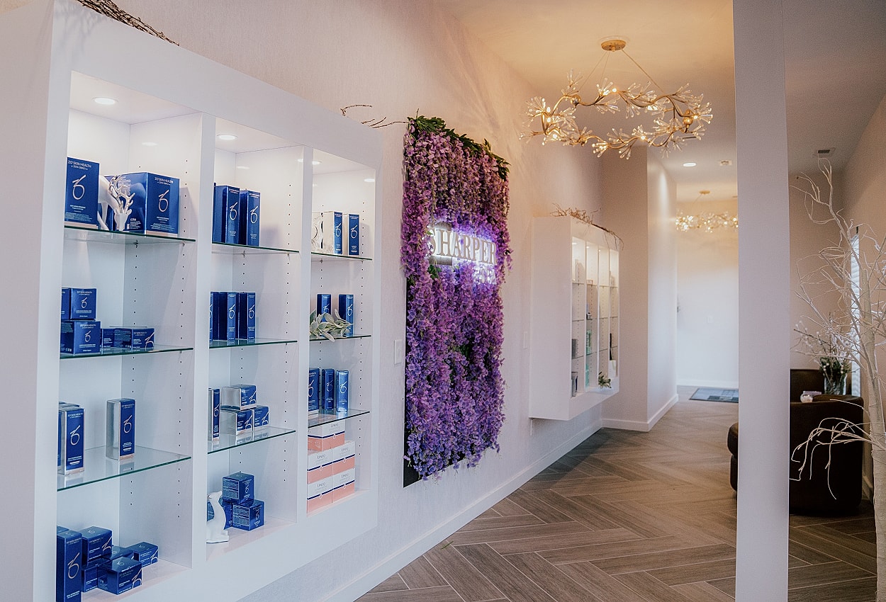 Modern skincare clinic interior with product displays.