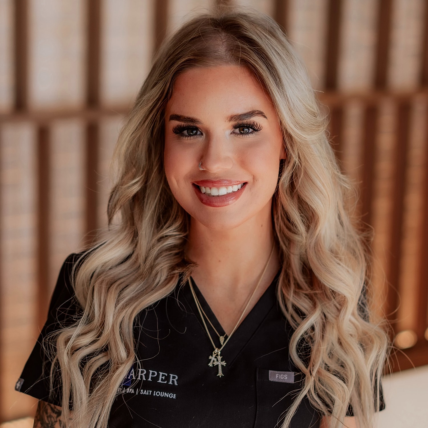 Smiling woman in professional attire with long hair