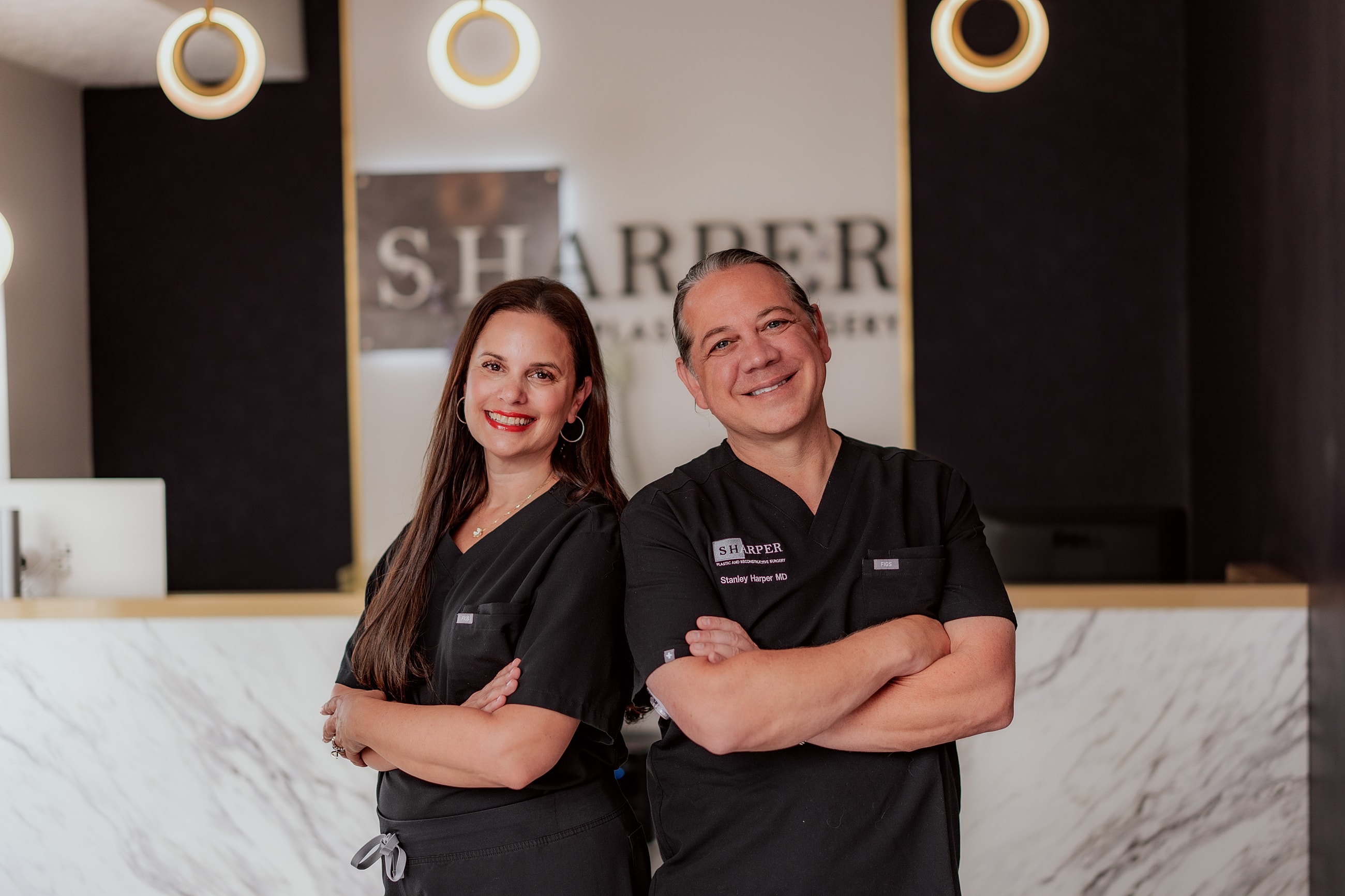 Medical professionals posing in a clinic setting.