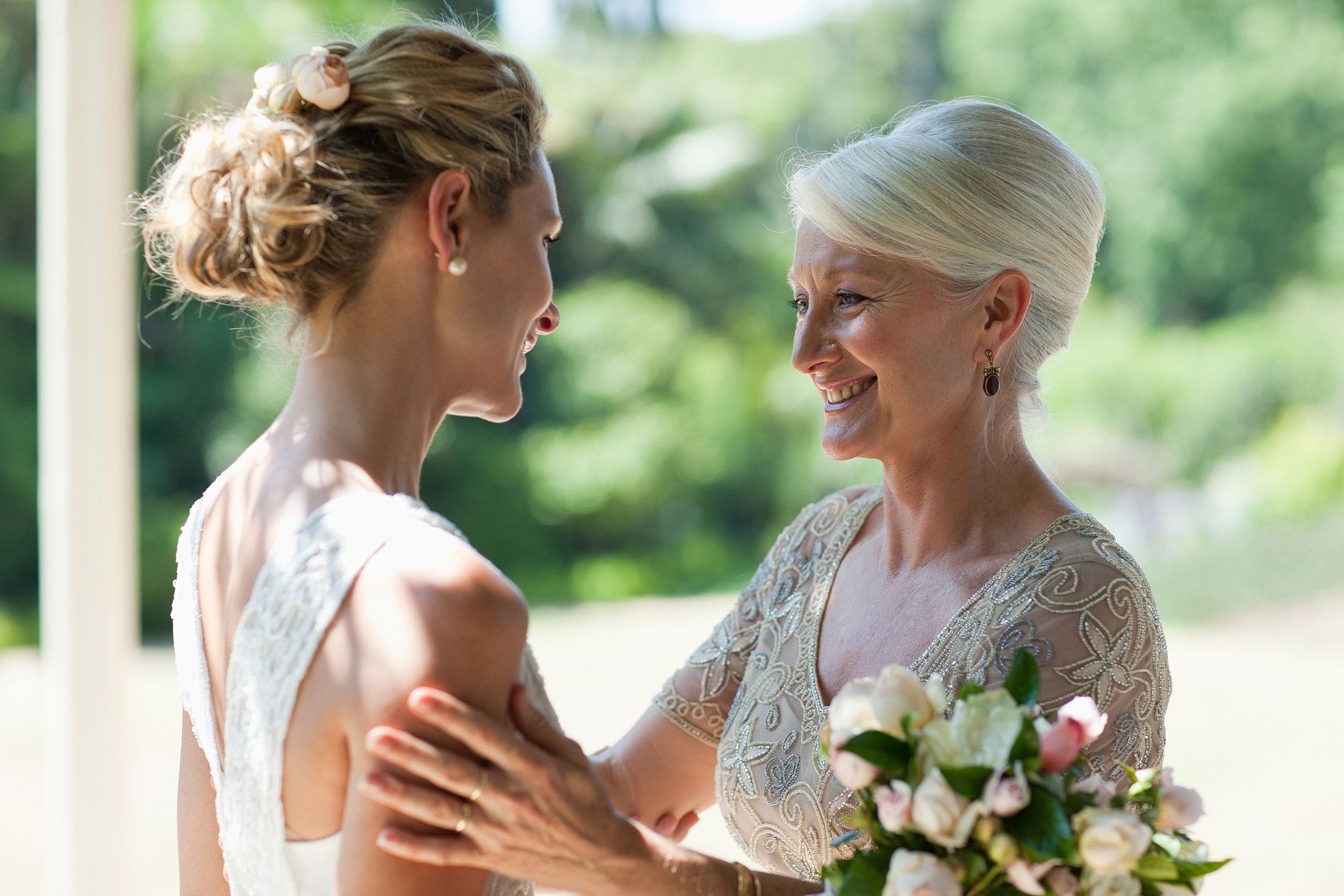 Bride and mother sharing a joyful moment.