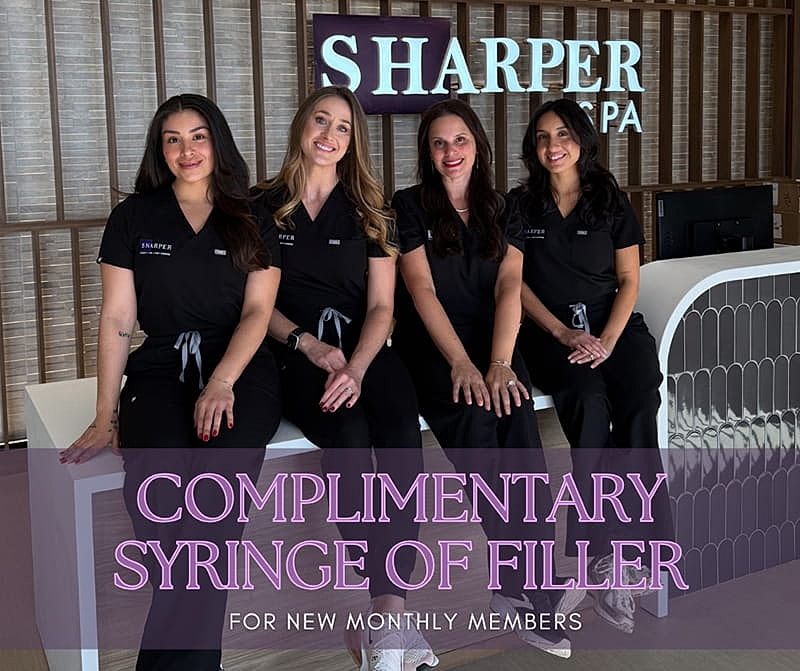 Spa team promoting complimentary filler offer.