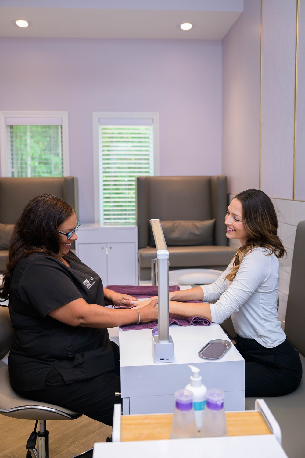 avon nail patient smiling while receiving service